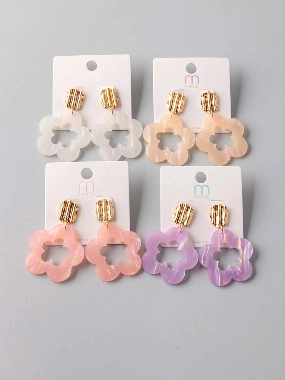 Blossom Pearl Flower Earrings in violet, white, peach, and pink colorways with delicate pearl accents