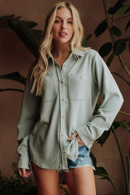 Relaxed fit blue women's button-up top side view