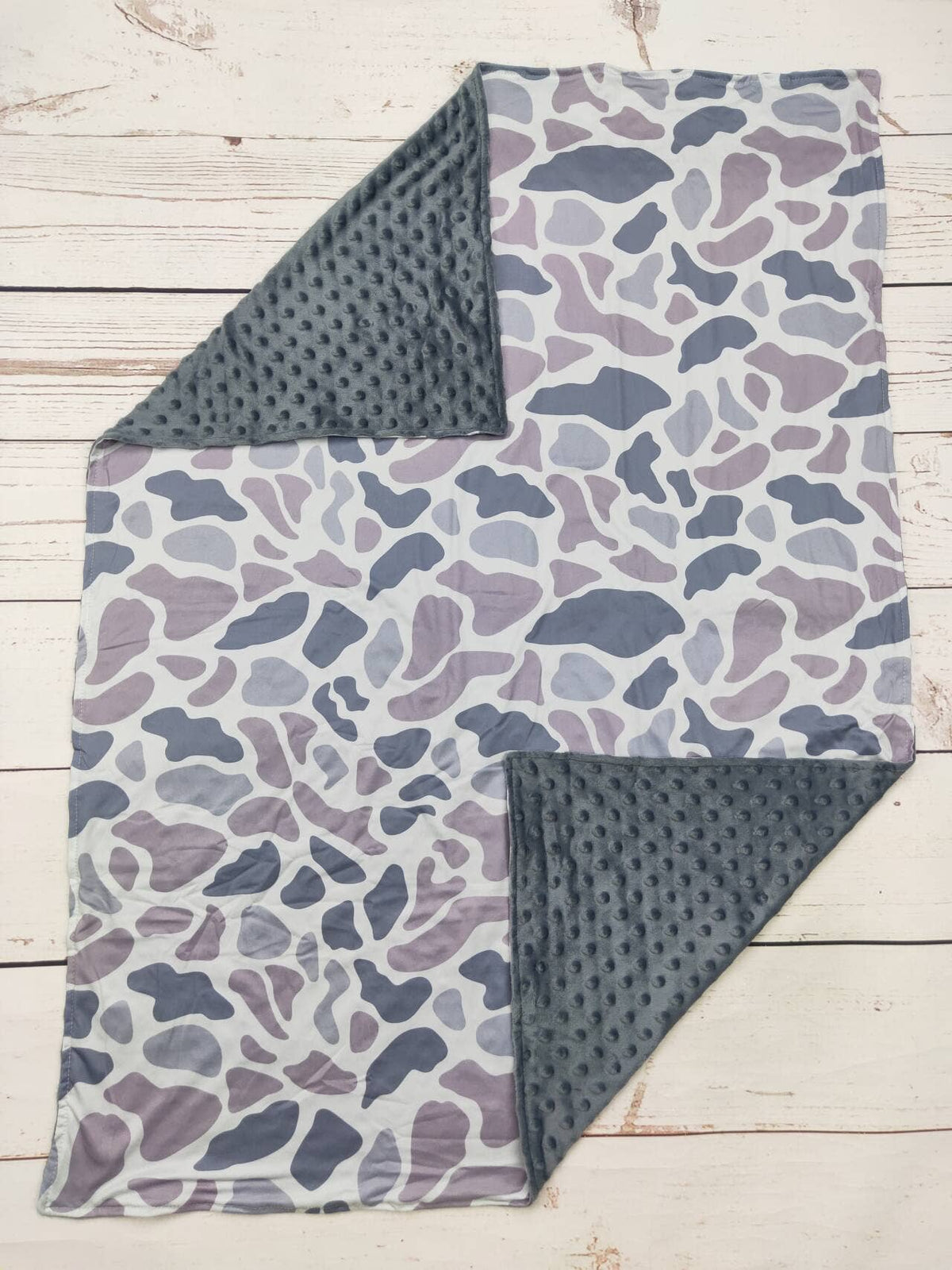 Gray camouflage baby blanket with soft textured gray backing