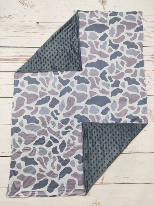 Gray camouflage baby blanket with soft textured gray backing
