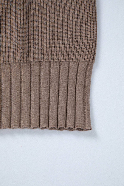 Brown knitted sweater sleeve on a white background