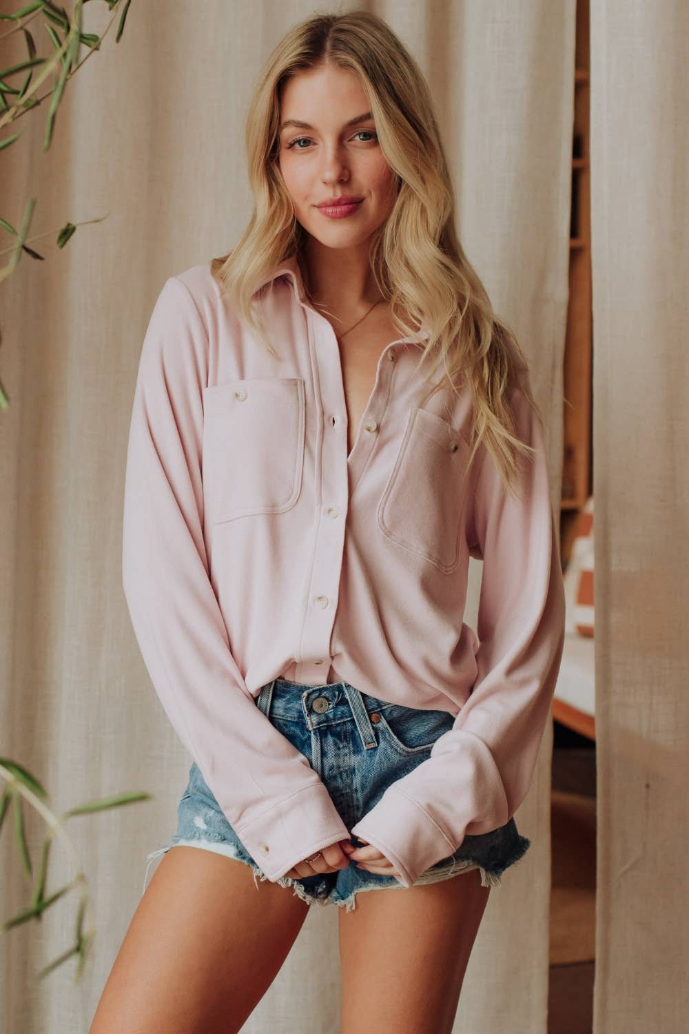 Light pink soft button-up women's boutique top front view