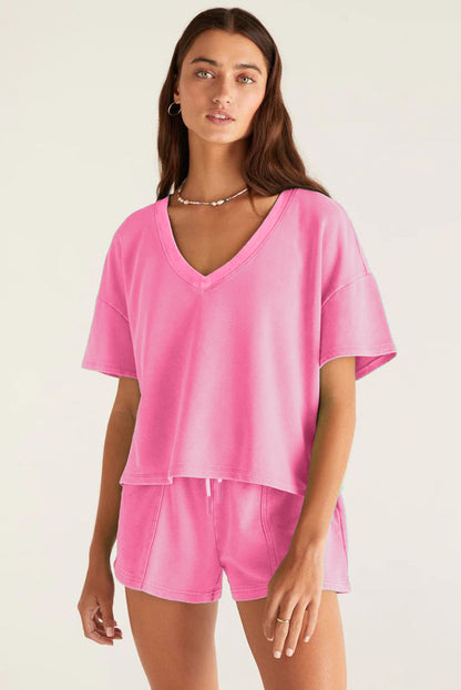 Woman wearing a pink outfit on a white background