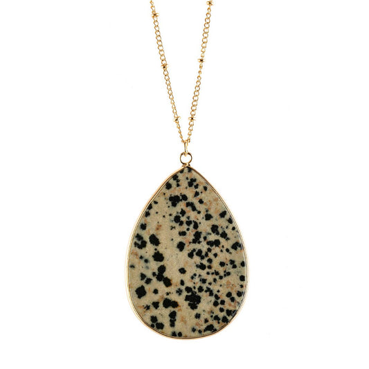 Necklace with a teardrop-shaped dalmatian jasper pendant on a white background