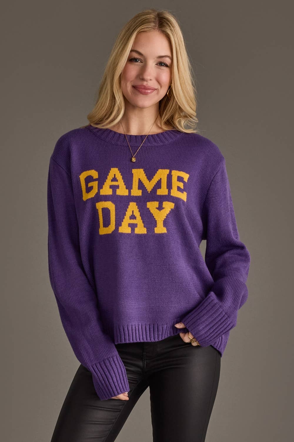 Gold Game Day lettering on purple women's sweater