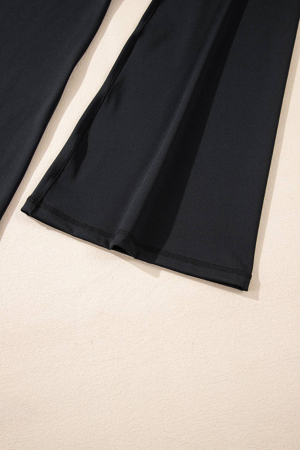 Black fabric on a beige background