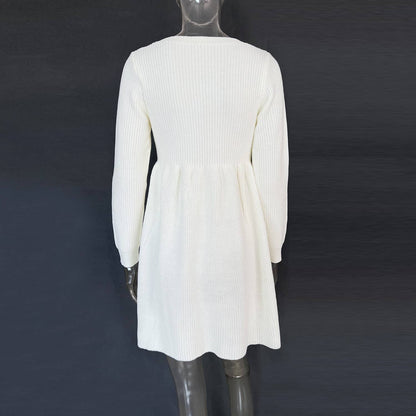 White ribbed dress on a mannequin against a dark background