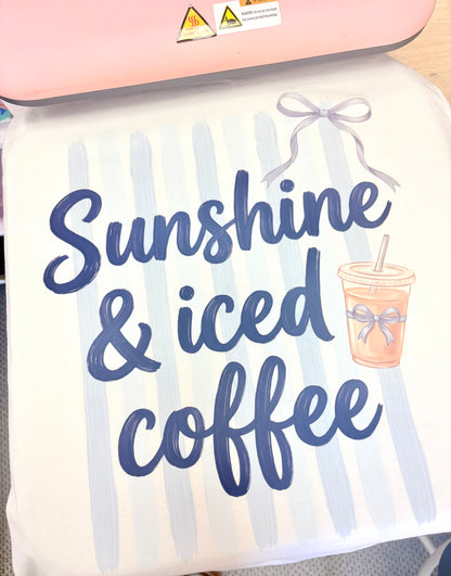 Decorative pillow with 'Sunshine & iced coffee' text and a coffee cup graphic.