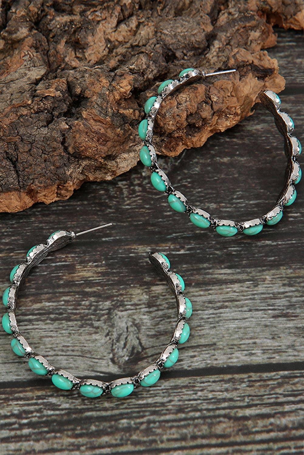 Close-up of hand-inlaid turquoise gemstone bead hoop earrings