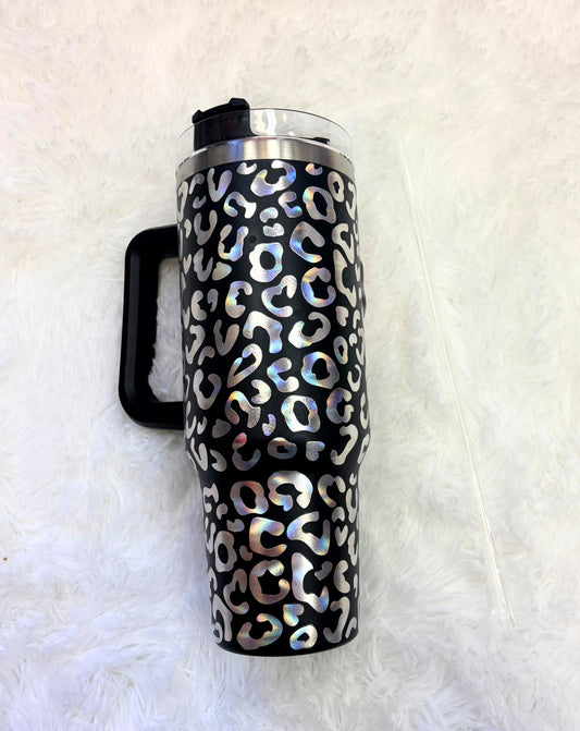 Travel mug with leopard print pattern on a white background