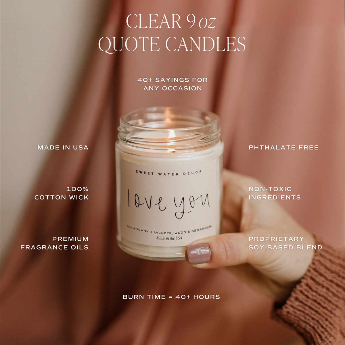 Clear 9 oz quote candle held by a hand with product details on a blurred background