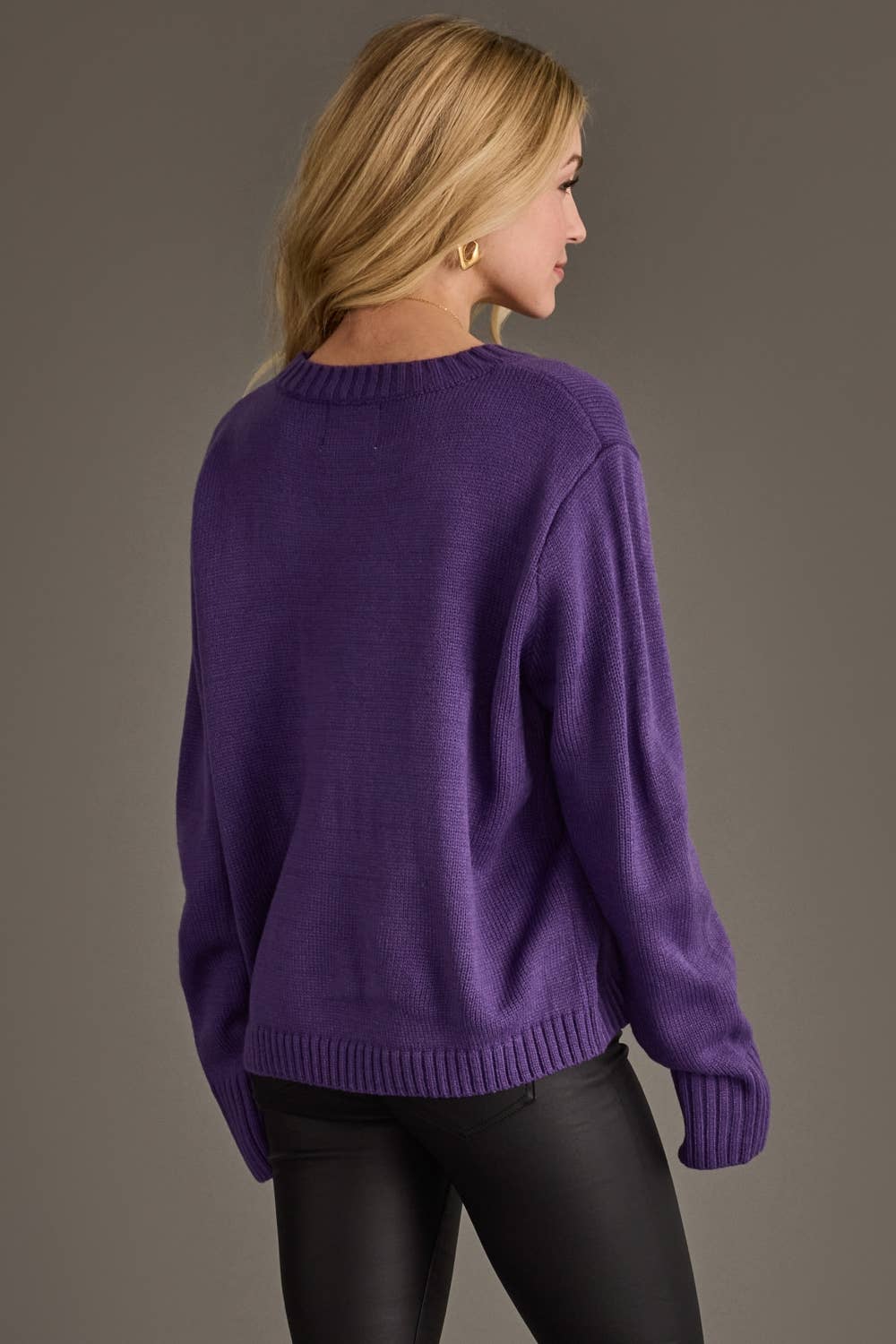 - Back view of purple women's knit sweater