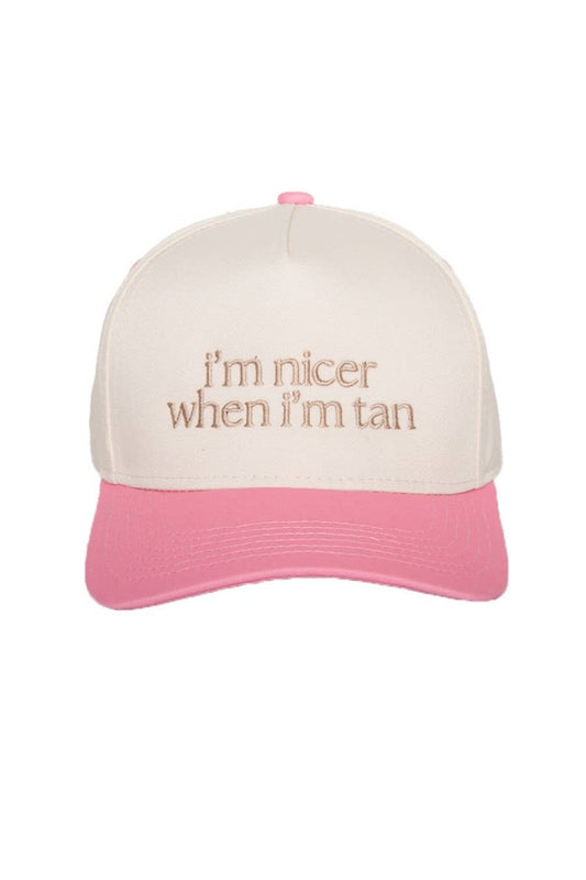Pink and beige cap with text 'I'm nicer when I'm tan' on a white background