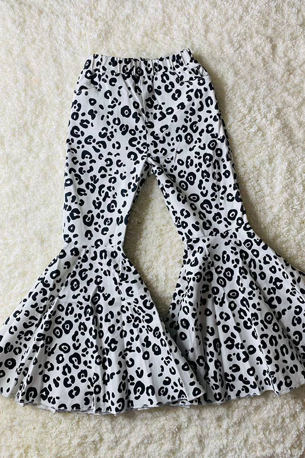 Leopard print pants on a textured surface