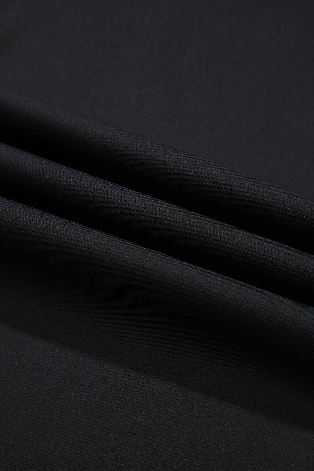 Close-up of black fabric with folds