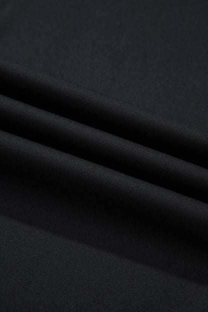 Close-up of black fabric with folds