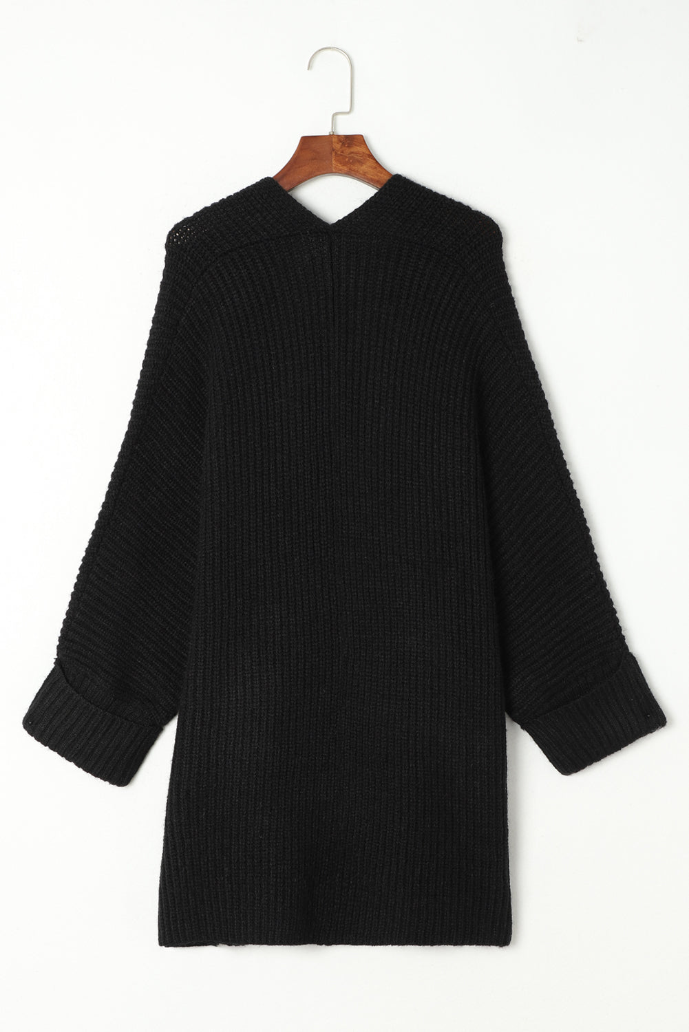 Black sweater on a hanger against a white background