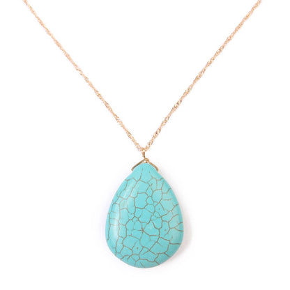 Turquoise teardrop pendant necklace on a white background