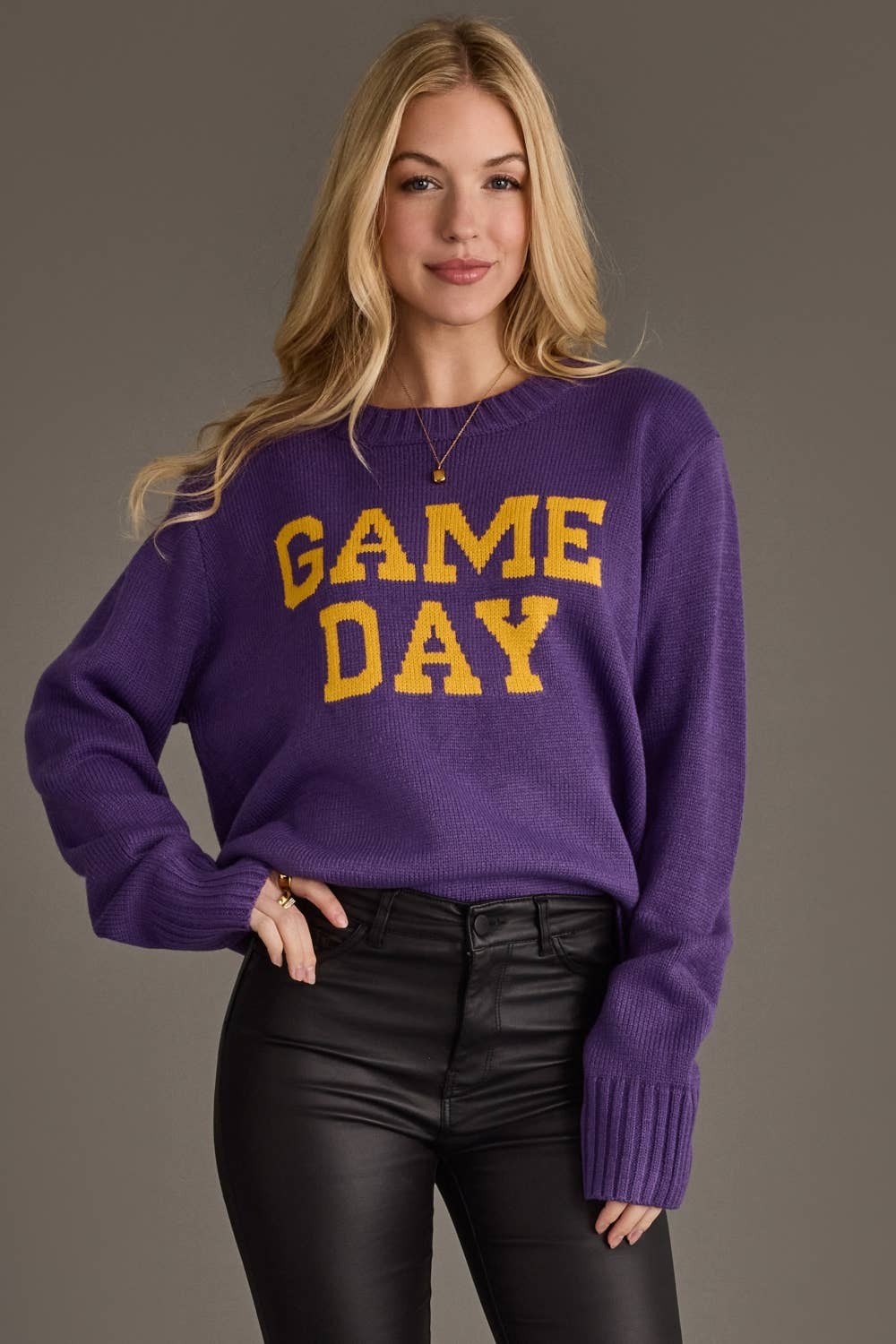 Women's purple Game Day sweater with gold lettering
