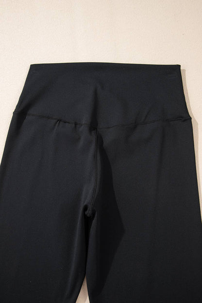 Black pants on a beige background