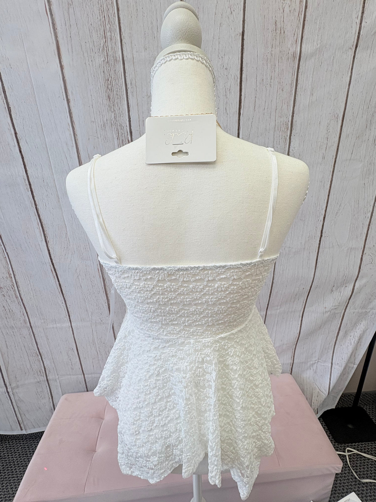 The PS Collective yellow lace peplum top detail — delicate floral lace texture with straight neckline and adjustable straps
