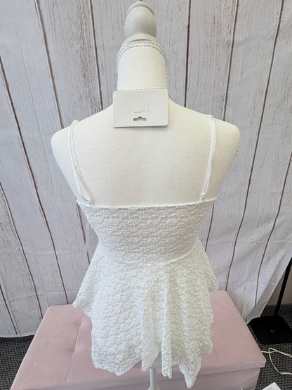 The PS Collective yellow lace peplum top detail — delicate floral lace texture with straight neckline and adjustable straps