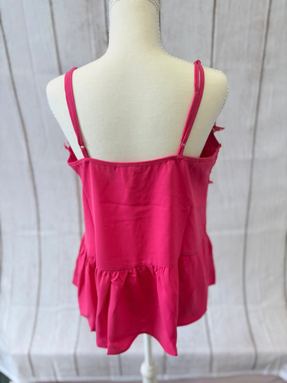 Red tank top on a mannequin against a neutral background
